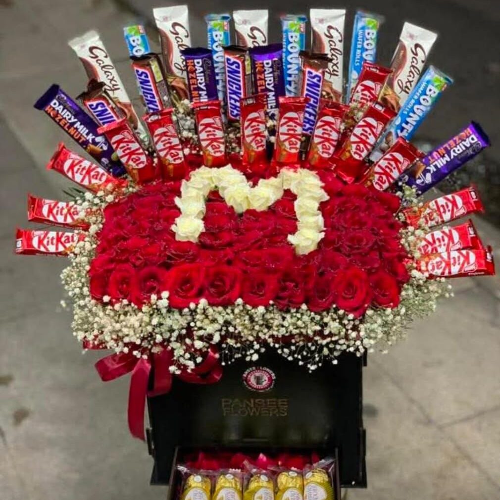 Box of natural red roses with letter M and assorted chocolates