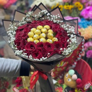Bouquet of natural red roses with Ferrero Rocher chocolates