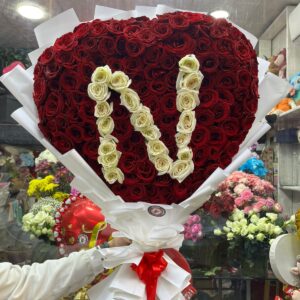 Heart-shaped bouquet of natural roses with letter N
