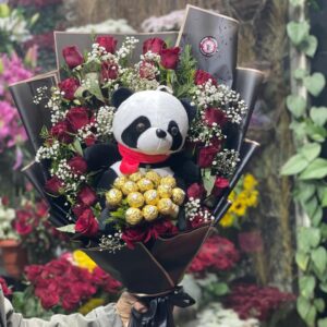 Bouquet of natural red roses with Ferrero Rocher chocolates and panda plush