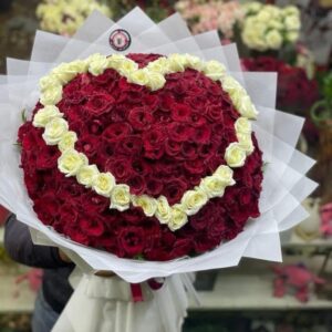 Large bouquet of natural red roses with white heart design